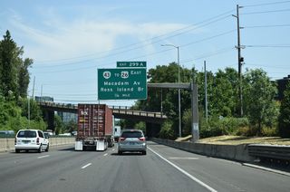 A split diamond interchange at Exit 299 A links Interstate 5 with Macadam Avenue, U.S. 26 (Ross Island Bridge), and the north end of OR 43 (Macadam Avenue). 