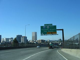 Two lanes partition from the Marquam Bridge for I-84/U.S. 30 east. The Dalles is 84 miles away at the eastern end of the Columbia River Gorge.