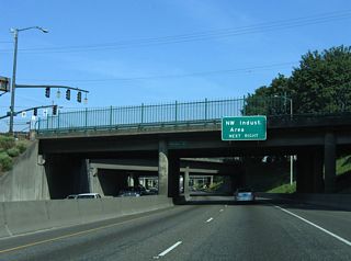 U.S. 30 overlaps with I-405 south across the Fremont Bridge to the Northwest Industrial Area in Portland. Though there is still a fair amount of industry remaining, some areas of former light industrial and warehouse sites, such as the Pearl District, were converted to high-density housing and artsy commercial developments.