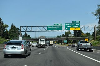 Interstate Avenue (OR 99W) is several blocks to the west of the freeway where it runs a parallel course with I-5 through north Portland. The Interstate MAX light rail also lines the center of Interstate Avenue.