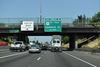 Exits 305 A/B follows Rosa Parks Way at a half cloverleaf interchange with U.S. 30 Bypass (Lombard Street). U.S. 30 Bypass travels 14.76 miles east from U.S. 30 near Cathedral Park to the Gresham city line.