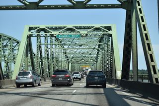 The Interstate Bridge consists of two narrow draw bridges. The northbound span predates the U.S. highway system, having carried the Pacific Highway and later U.S. 99 across the Columbia River. It replaced ferry service between Portland and Vancouver.