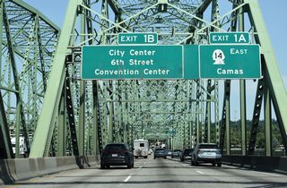 Back to back ramps depart at the north end of the Interstate Bridge for SR 14 (Lewis and Clark Highway) east and C Street north / 6th Street west to the Vancouver city center.