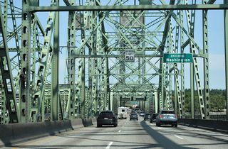 The Washington state line crosses I-5 midway across the Columbia River.