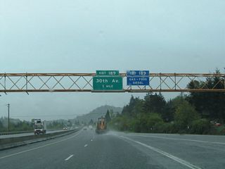 I-5/OR 99 parallel Old U.S. 99 (Franklin Boulevard) and the Southern Pacific Railroad corridor south to Goshen. Franklin Boulevard turns south from OR 126 Business at Glenwood. The ensuing exit is a split diamond interchange for 30th Avenue west.