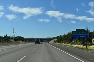 A directional cloverleaf interchange joins I-5 with I-105/OR 126 at Exit 194. I-105/OR 126 overlap west to Coburg Road, which spans the Willamette River south to Downtown Eugene, west of the University of Oregon.