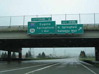 I-5 south at the cloverstack interchange (Exit 195) with OR 569 (Randy Papé Beltline). The addition of a flyover from I-5 north to OR 569 west in 2008 coincided with the removal of the loop ramp for Beltline Road east. OR 569 comprises a freeway bypass around Eugene west from I-5 to Santa Clara and south to Barger Drive. Belt Line Road extends east from adjacent Gateway Street to MLK, Jr. parkway in north Springfield.