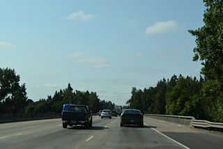 Interstate 5 crosses the Willamette River south ahead of mile marker 283 in south west of Charbonneau in Wilsonville.
