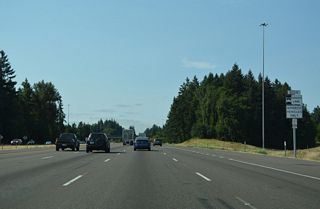 The shoulder opens as a Bus Rapid Transit (BRT) lane along Interstate 5 south within the exchange at I-205.