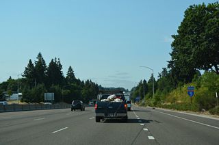Interstate 5 lowers to cross the Tualatin River ahead of the parclo interchange (Exit 289) with Nyberg Street.