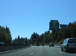 Advancing toward the Portland city line, Interstate 5 meets Barbur Boulevard (OR 99W) a final time at Exit 294.