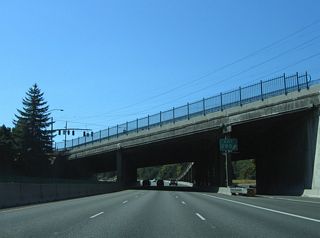 Barbur Boulevard (old OR 99W) and Capitol Highway intersect on overpasses above Interstate 5. Exit 295 constitutes a southbound off-ramp and northbound return ramp.