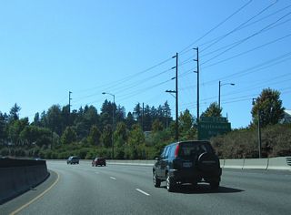 A wye interchange (Exit 296 B) follows on I-5 southwest with Multnomah Boulevard west. Multnomah Boulevard leads west to the Maplewood and Ashcreek neighborhoods of Portland.