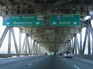 Two lane ramps seprate for I-405 (Stadium Freeway) north to U.S. 26 (Sunset Highway) and I-5 south to Tigard and Salem. The left exit for Interstate 405 is a result of plans bringing the Mount Hood Freeway onto the left side of the Marquam Bridge.