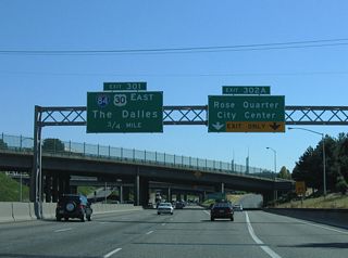 I-5/U.S. 30 overlap 0.75 miles south to Exit 301 and Interstate 84. Points of interest for Exit 302 A include the Oregon Convention Center and Lloyd Center shopping mall.