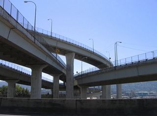 Flyovers link I-5/405 above two bridges on the Stadium Freeway mainline that link with Kirby Avenue. The stadium freeway derives its name from Providence Park, which was formerly named Civic Stadium ("Providence Park", 2006).