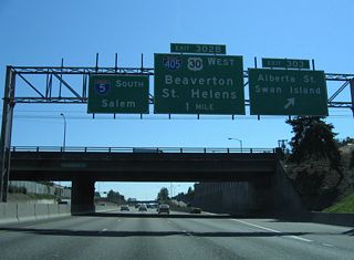 Exit 303 joins a collector distributor roadway alongside Minnesota Avenue ahead of Alberta Street. Alberta Street links with Interstate Avenue between Killingsworth and Going Streets at the Overlook community. Going Street is the main route to industrialized Swan Island.