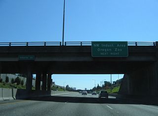 Interstate 405 combines with U.S. 30 west across the Fremont Bridge over the Willamette River. U.S. 30 partitions with the Stadium Freeway at Exit 3 through the Northwest Industrial Area. Interests to Oregon Zoo are directed onto I-405 south to U.S. 26 (Sunset Highway) west.