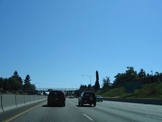 The diamond interchange (Exit 304) with Rosa Parks Way follows the partial exchange with U.S. 30 Bypass (Lombard Street) on I-5 south. Rosa Parks Way meets Interstate Avenue (old U.S. 99W) two blocks to the west and continues from there to Willamette Boulevard. Willamette Boulevard winds westward along Mocks Crest to the University of Portland.