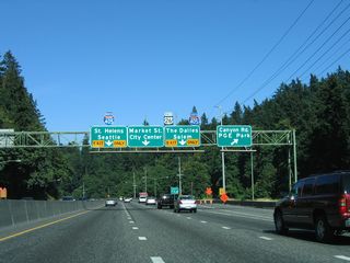 Eastbound U.S. 26 (Sunset Highway) advances to the Vista Ridge Tunnel beyond Exit 73 to Canyon Road. The exchange with Interstate 405 follows.