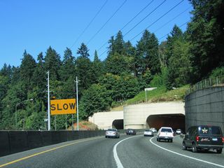 U.S. 26 (Sunset Highway) curves east into the Vista Ridge Tunnel from Washington Park.