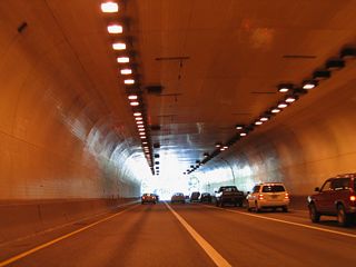 U.S. 26 emerges east from the Vista Ridge Tunnel at the Goose Hollow neighborhood.