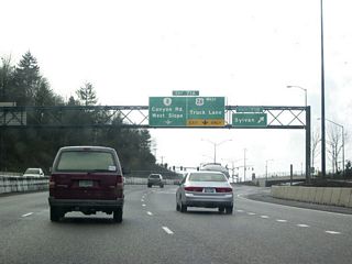 Exit 71 B connects U.S. 26 with Scholls Ferry Road and Skyline Boulevard at the top of Sylvan Hill. At 761 feet in elevation, the hill's summit can sometimes impose winter driving hazards, even though it may only be raining in other parts of the city. The Portland city limits lie just beyond the exit.
