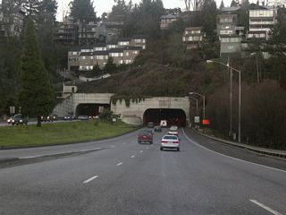 Ramps from I-405, U.S. 26 and SW Clay Street at Downtown Portland combine west along Sunset Highway ahead of the Vista Ridge Tunnel.