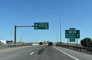 The 20.56 mile overlap with U.S. 395 from Kennewick, Washington concludes at Exit 1. U.S. 395 runs 13.6 miles through the city of Hermiston before joining I-84 east at Stanfield. U.S. 730, a 42 mile route between I-84 near Boardman and U.S. 12 near Wallula, follows 6th Street through the Umatilla city center en route to Irrigon.