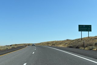 Eight miles of eastbound Interstate 82 remain. Pendleton and Portland, destinations along I-84, are referenced at 40 and 187 miles away respectively.
