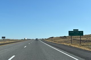 Powerline Road leads south from U.S. 730 and Umatilla to cross paths with Interstate 82 at a diamond interchange (Exit 5) in one mile.