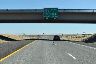 Passing under Lamb Road on I-82 east. Interstate 84 follows the Columbia River west to The Dalles, Hood River and Portland.