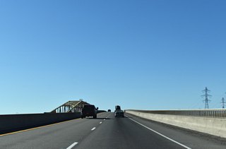 I-82/U.S. 395 north cross a rather nondescript bridge traveling 80 feet above the Columbia River. The westbound span totals 3,433 feet in length.&sup1;