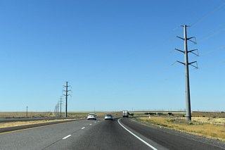 Power lines cross over Interstate 82 as the freeway leaves Umatilla Army Depot near the overpass for Bridge Road.