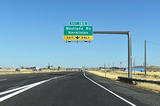 The diamond interchange with Westland Road is the first of two to serve Hermiston along I-84 / U.S. 30 east beyond I-82.