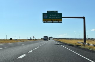 I-84 / U.S. 30 continue west from Westland Road (Exit 180) to a directional T interchange with I-82 west to Hermiston, Umatilla, and Kennewick, Washington.