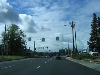 U.S. 199 formerly turned west onto Redwood Highway from 6th Street. This later was part of a business route for U.S. 199, with a Bypass route designated along the continuation of Redwood Highway east to Interstate 5.