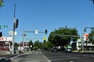 Blair Boulevard angles northwest from Monroe Street across OR 99/126 to a dead end beyond W 1st Avenue.