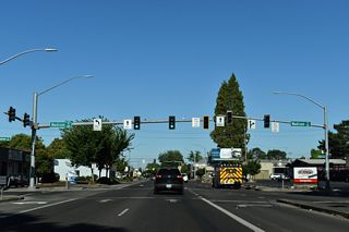OR 126 Business ends where OR 126 joins OR 99 northbound at Madison Street.