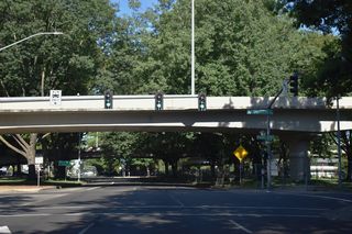 OR 99/126 Business proceed west from Washington Street to Jefferson Street underneath the ramps linking I-105/OR 126 and 7th Avenue.