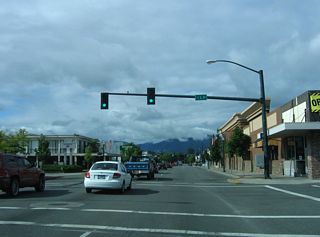 The next traffic signal is for L Street, which is part of the Downtown Grants Pass street grid.