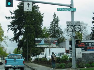 OR 126 Business commences east along 7th Avenue at Washington Street. The bannered route overlaps with OR 99 southbound through downtown Eugene to the University of Oregon campus.