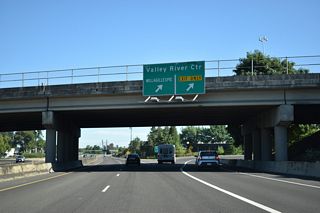 Valley River Road is a commercial boulevard west from adjacent Willagillespie Road to Valley River Center mall and Goodpasture Island Road. Willagillespie Road extends north from Country Club Road to Cal Young Road and Fir Acres Drive near Gillespie Butte (elevation 605 feet).