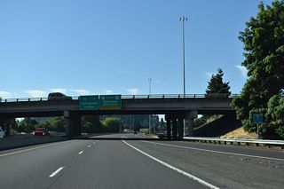 Separate entrance ramps join OR 132 (Delta Highway) south from Valley River Drive. The loop ramp joins the mainline ahead of the trumpet interchange with I-105/OR 126.
