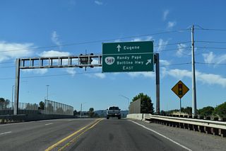 Delta Highway enters the parclo interchange with OR 569 (Randy Pap&eacute; Beltline) south of Green Acres Road and west of Delta Oaks Shopping Center.