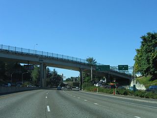 Leaving I-405 (Stadium Freeway) and Downtown, U.S. 26 advances 73.8 miles west to U.S. 101 south of Seaside. Locally, U.S. 26 travels along the freeway portion of Sunset Highway through the Vista Ridge Tunnel en route to western suburbs of Portland.