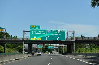 S Harbor Drive continues north from Left Exit 1 A as an at-grade boulevard to SW Naito Parkway and the National Historic District of Portland. I-405 shifts onto the Stadium Freeway around the west side of City Center.