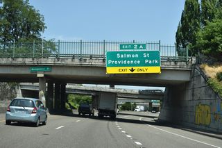 The Stadium Freeway turns northeast at SW Montgomery Street to run between SW 13th and 14th Avenues along the Portland street grid. Upcoming Exit 2 A to SW Salmon Street serves both the Oregon History and Portland Art Museums.