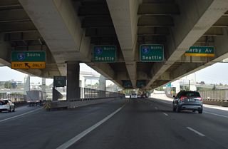 The right lane extends north from the Stadium Freeway along the East Fremont Interchange Connector to Kerby Avenue at Gantenbein Avenue and Boise section of the city. This spur was built as part of the planned Rose City Freeway, a cancelled road proposed northeast to the unconstructed Prescott Freeway.
