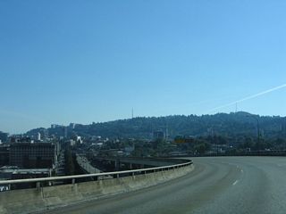 Turning south from the Fremont Bridge, Interstate 405 follows a viaduct from Exit 3 to Exit 2 B for Glisan Street.